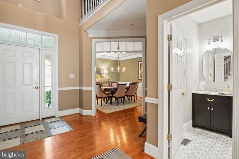 a living room with furniture a rug and a large window