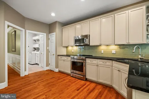 a view of a livingroom with furniture and stairs