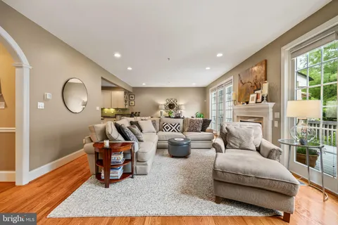 a bathroom with a tub sink shower and mirror