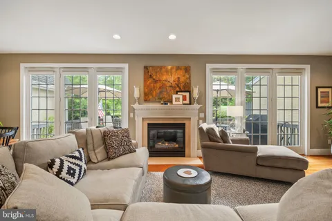 a view of a house with brick walls and a yard with plants