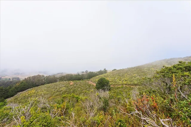 a group of people sitting in front of a building