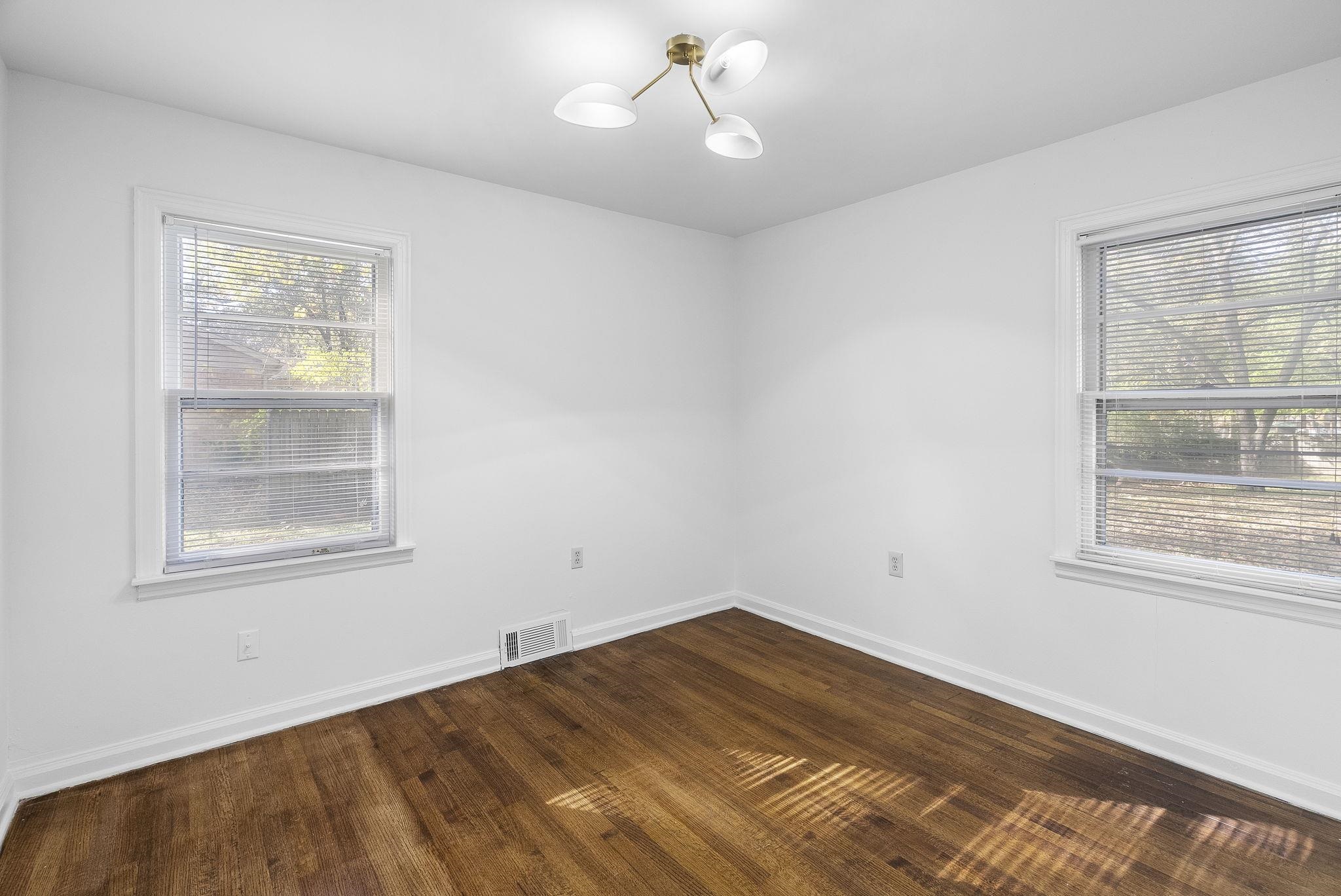 279 Quinn Road Collierville, TN 38017 - Photo 21 of 28 a view of empty room with wooden floor and fan