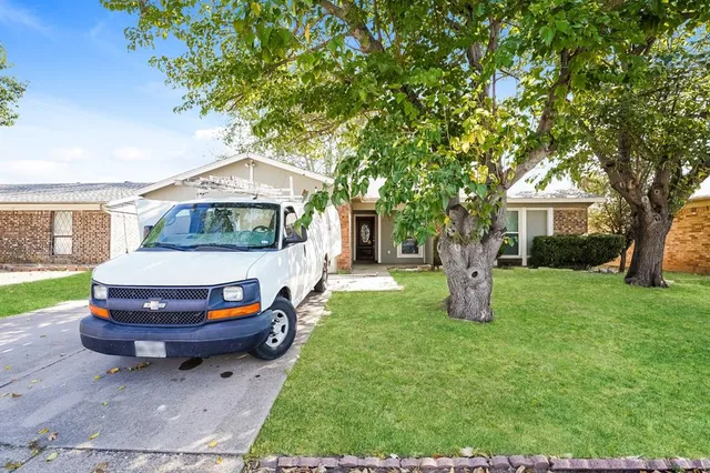 a house view with a garden space