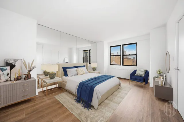 a bedroom with a bed and a couch