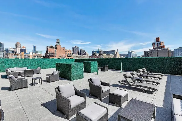 a view of a terrace with furniture and a table