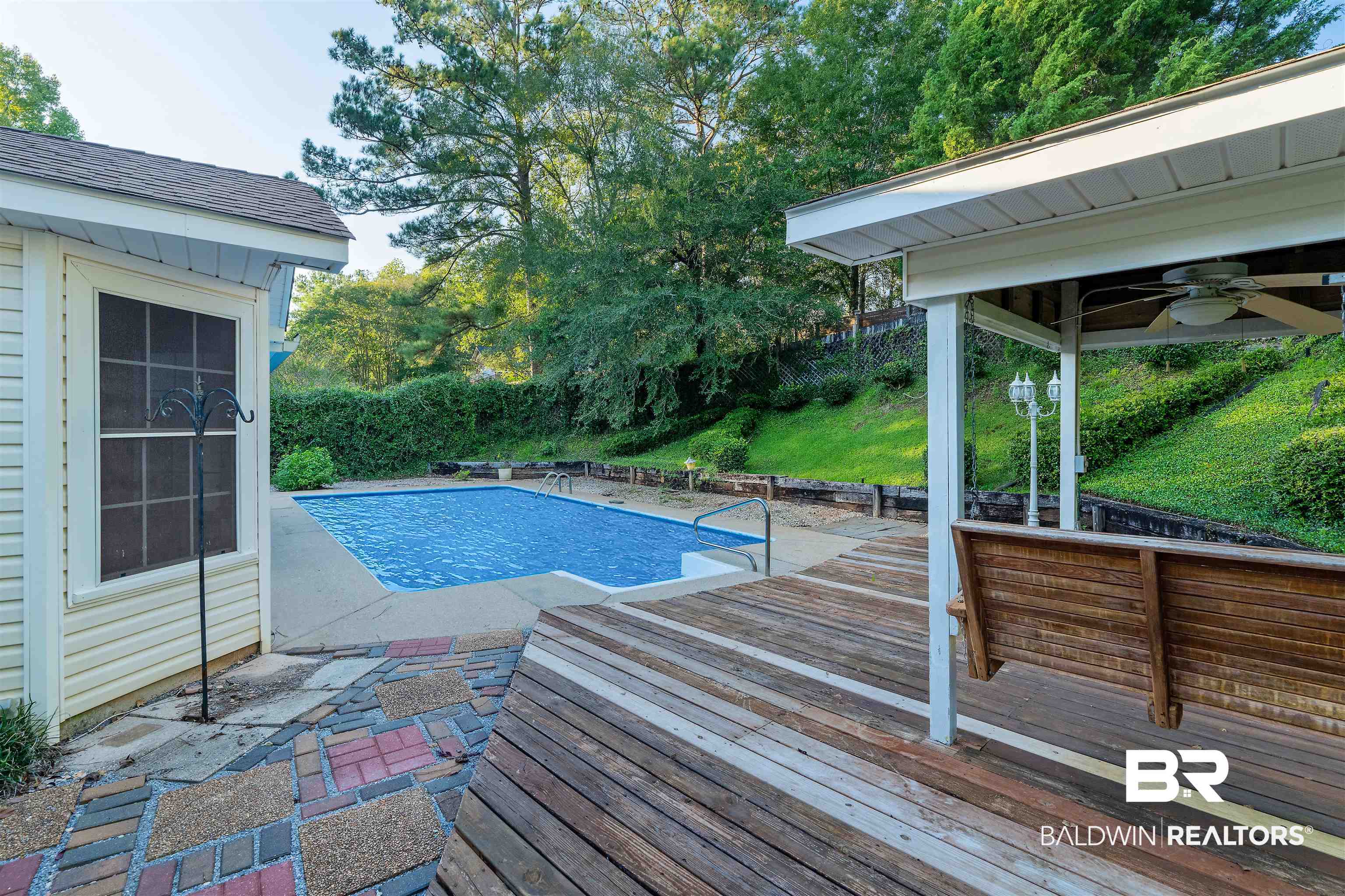 438 Ridgewood Drive Daphne, AL 36526 - Photo 21 of 28 View of pool featuring a wooden deck and ceiling fan