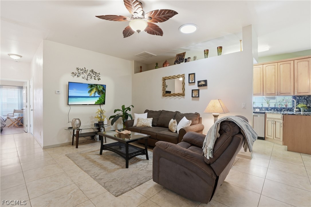 10730 Rio Mar Circle Estero, FL 33928 - Photo 5 of 47 a living room with furniture and a window