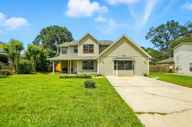 a front view of a house with garden