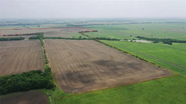 an aerial view of beach and yard