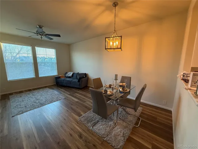a view of a livingroom with furniture window and wooden floor