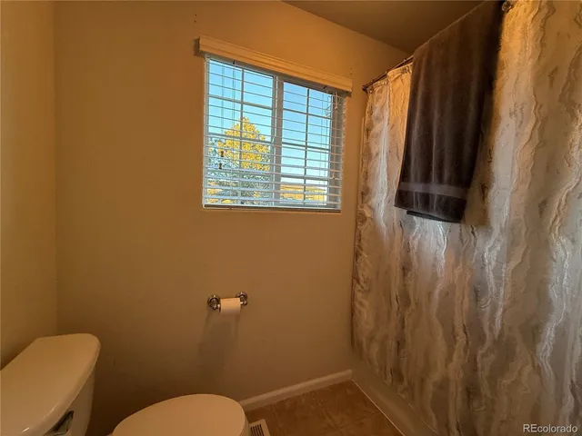 a bathroom with a toilet and a sink