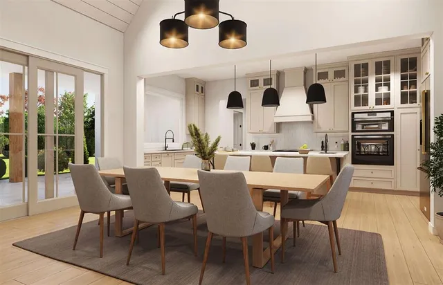a dining room with wooden floor and white walls