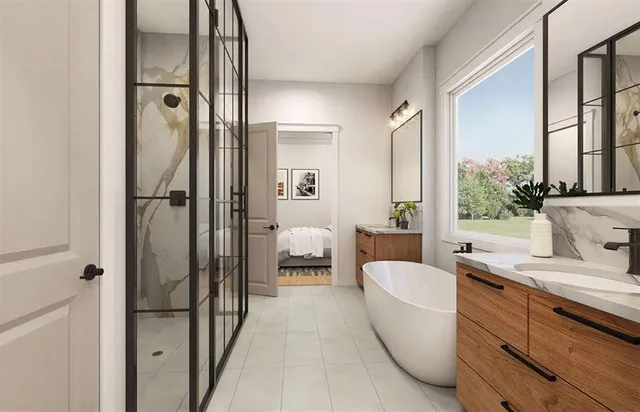 a en suite bathroom with a granite countertop tub and a large window