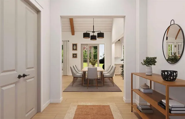 a living room with furniture a rug and a window