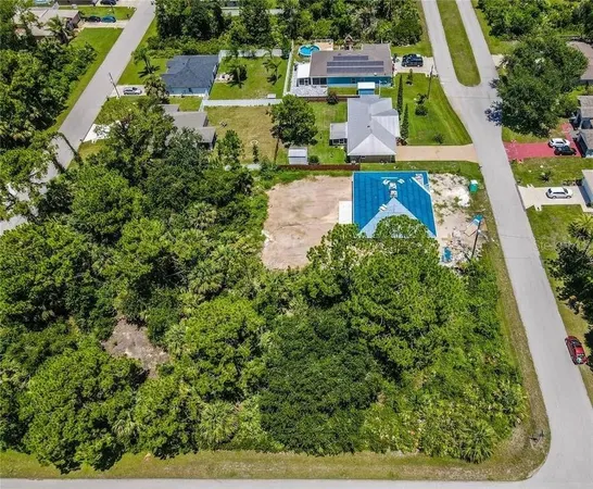 an aerial view of house with yard