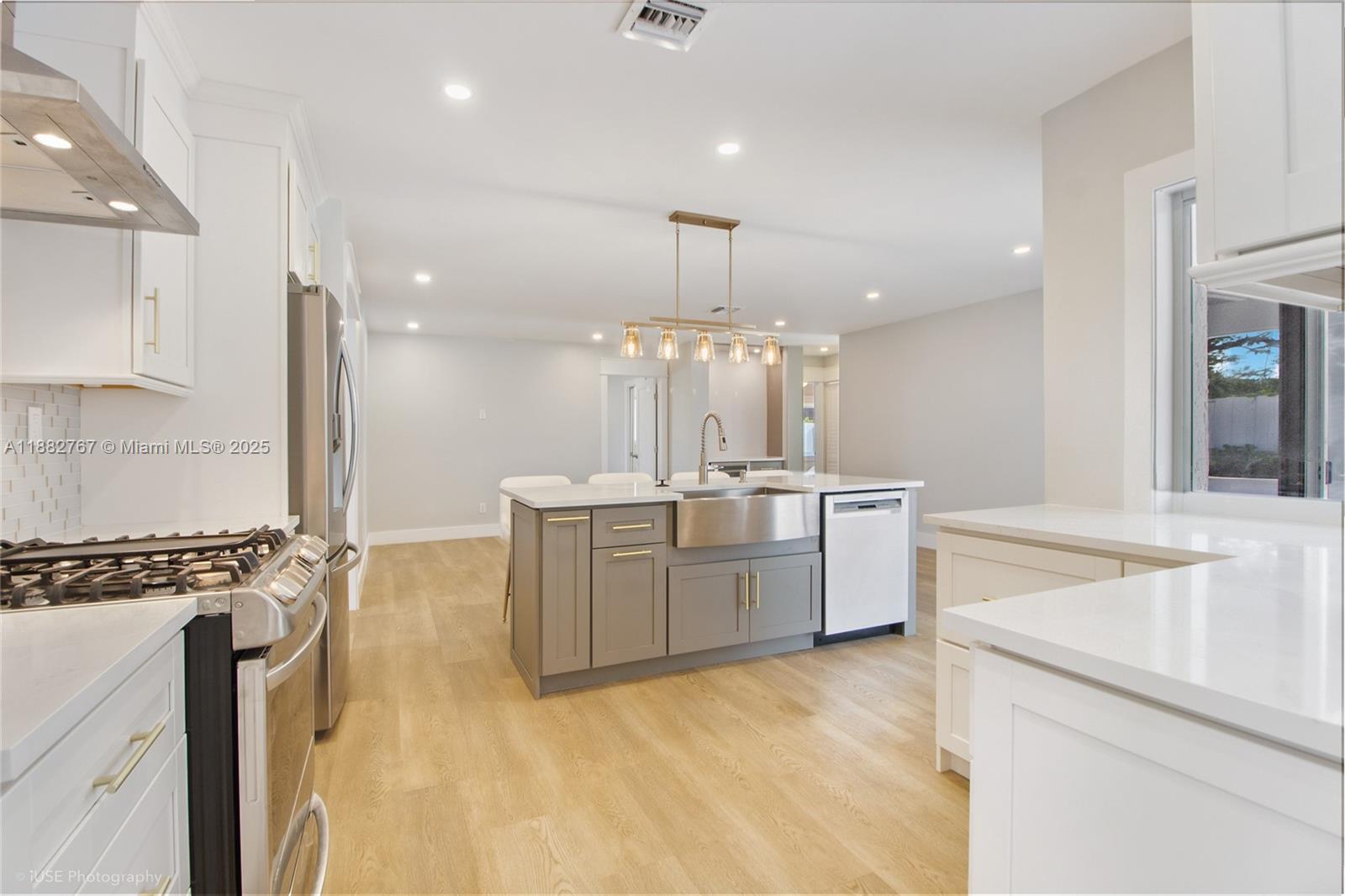 11011 Southwest 110th Road Miami, FL 33176 - Photo 13 of 19 a large kitchen with kitchen island a sink stainless steel appliances and cabinets