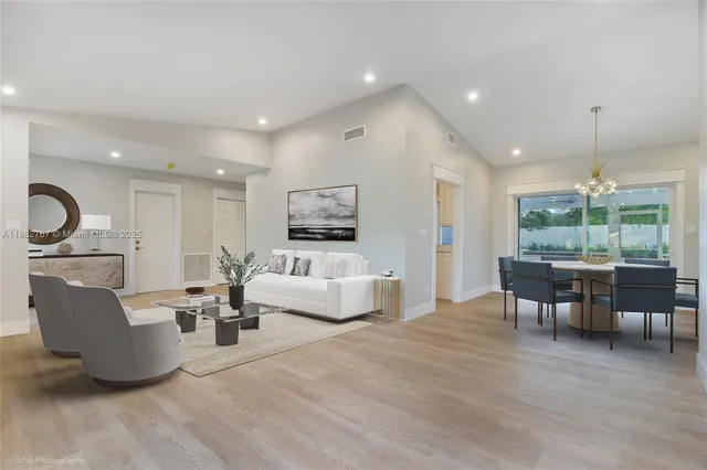 a spacious bedroom with a large bed and a couch