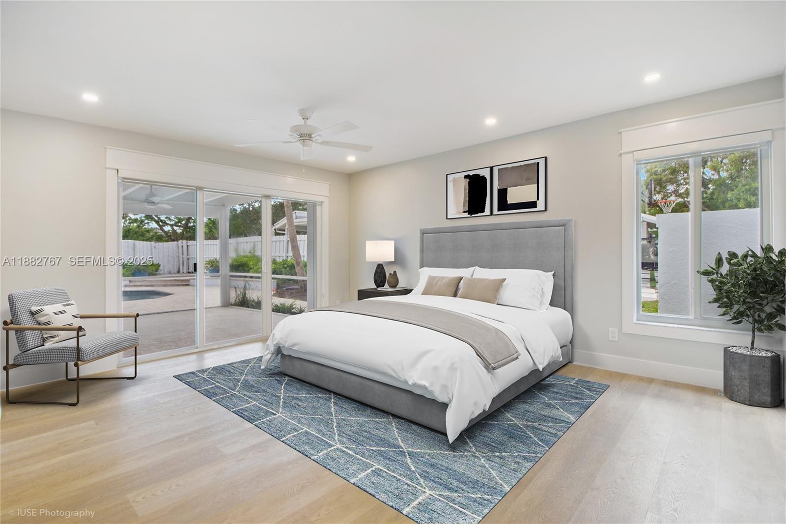 11011 Southwest 110th Road Miami, FL 33176 - Photo 17 of 19 a spacious bedroom with a large bed and a couch