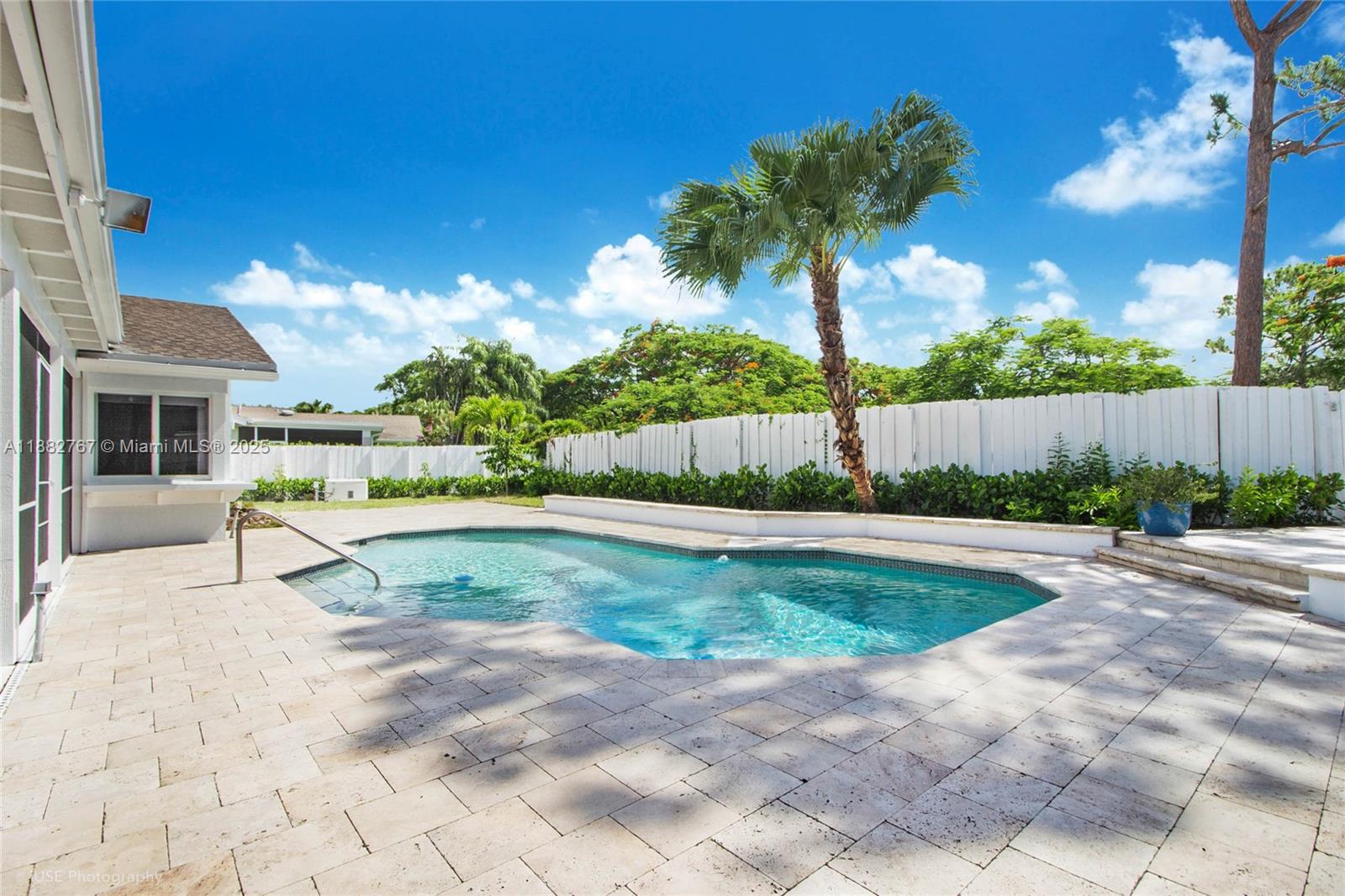 11011 Southwest 110th Road Miami, FL 33176 - Photo 4 of 19 a view of backyard with a garden and palm trees