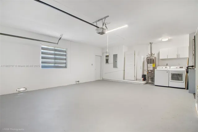 a view of a kitchen with a sink and a refrigerator