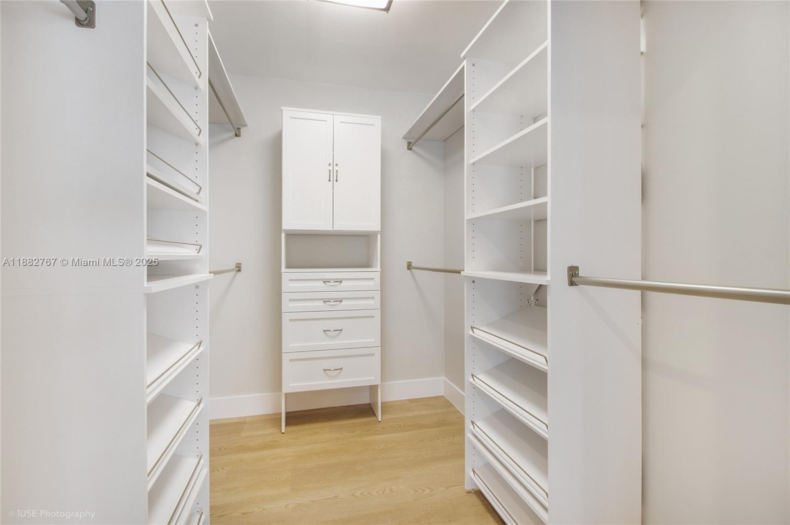11011 Southwest 110th Road Miami, FL 33176 - Photo 9 of 19 a view of walk in closet with empty racks