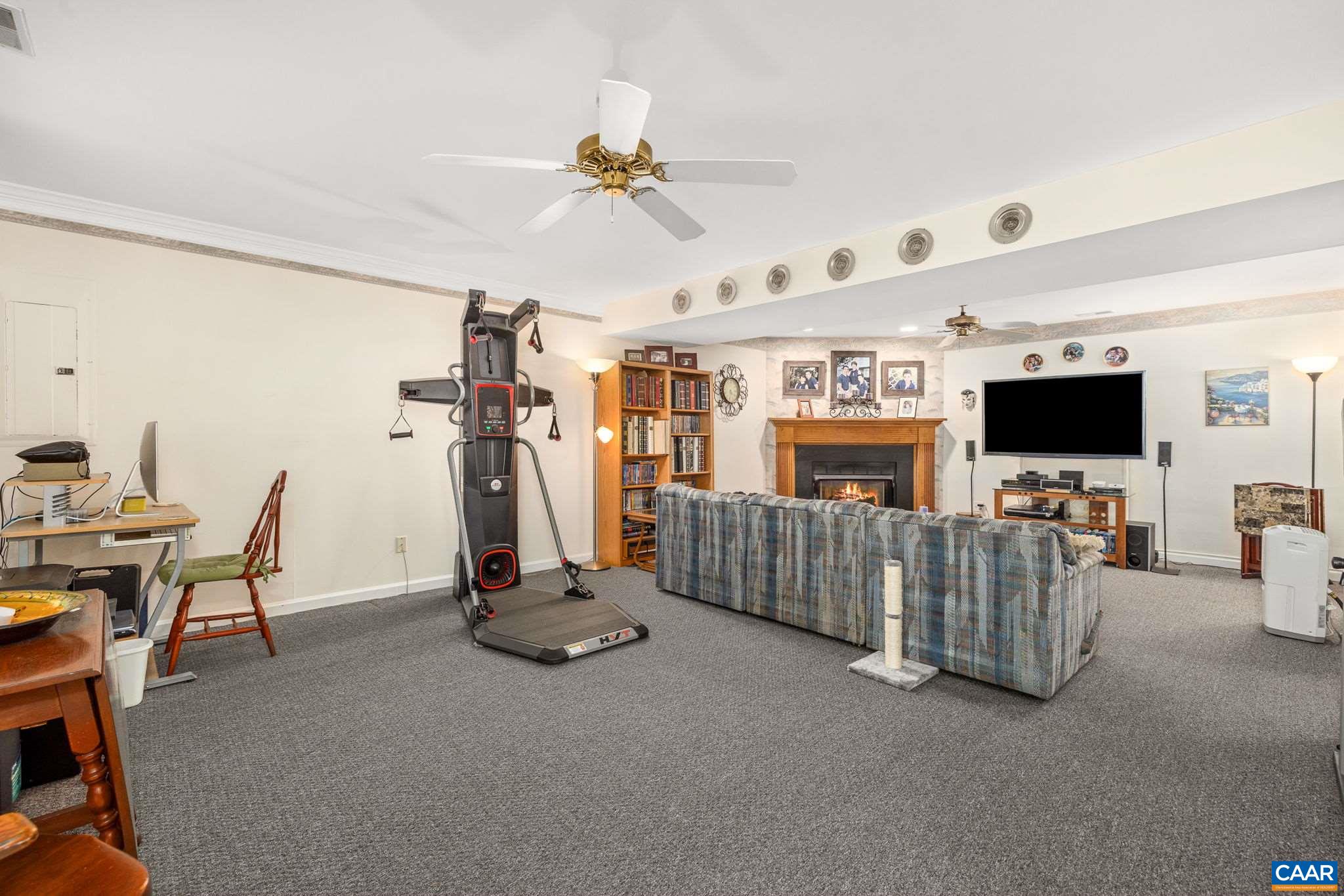 5 Dogleg Road Palmyra, VA 22963 - Photo 43 of 63 a view of a livingroom with furniture and a flat screen tv