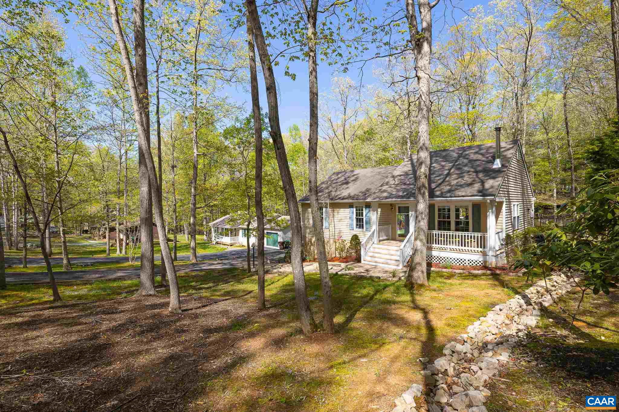 5 Dogleg Road Palmyra, VA 22963 - Photo 8 of 63 a view of a house with a large tree and a yard