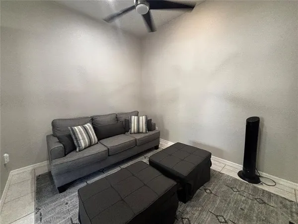 a living room with furniture and a rug