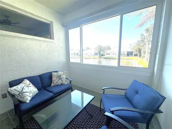 a living room with furniture and a window