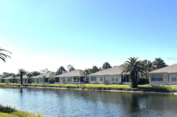 a front view of a house with a lake view