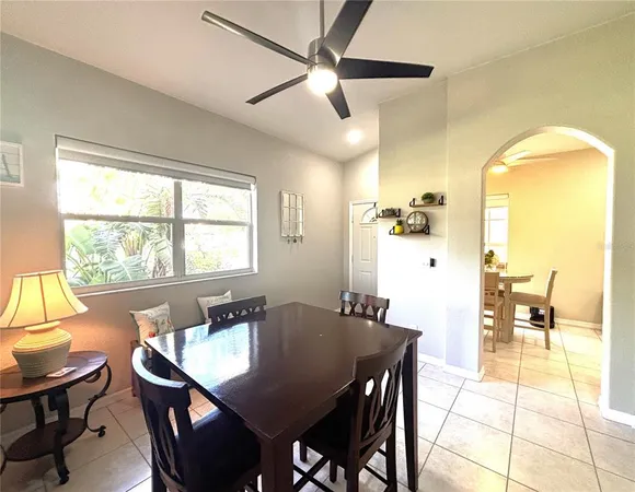a view of a dining room with furniture and a window