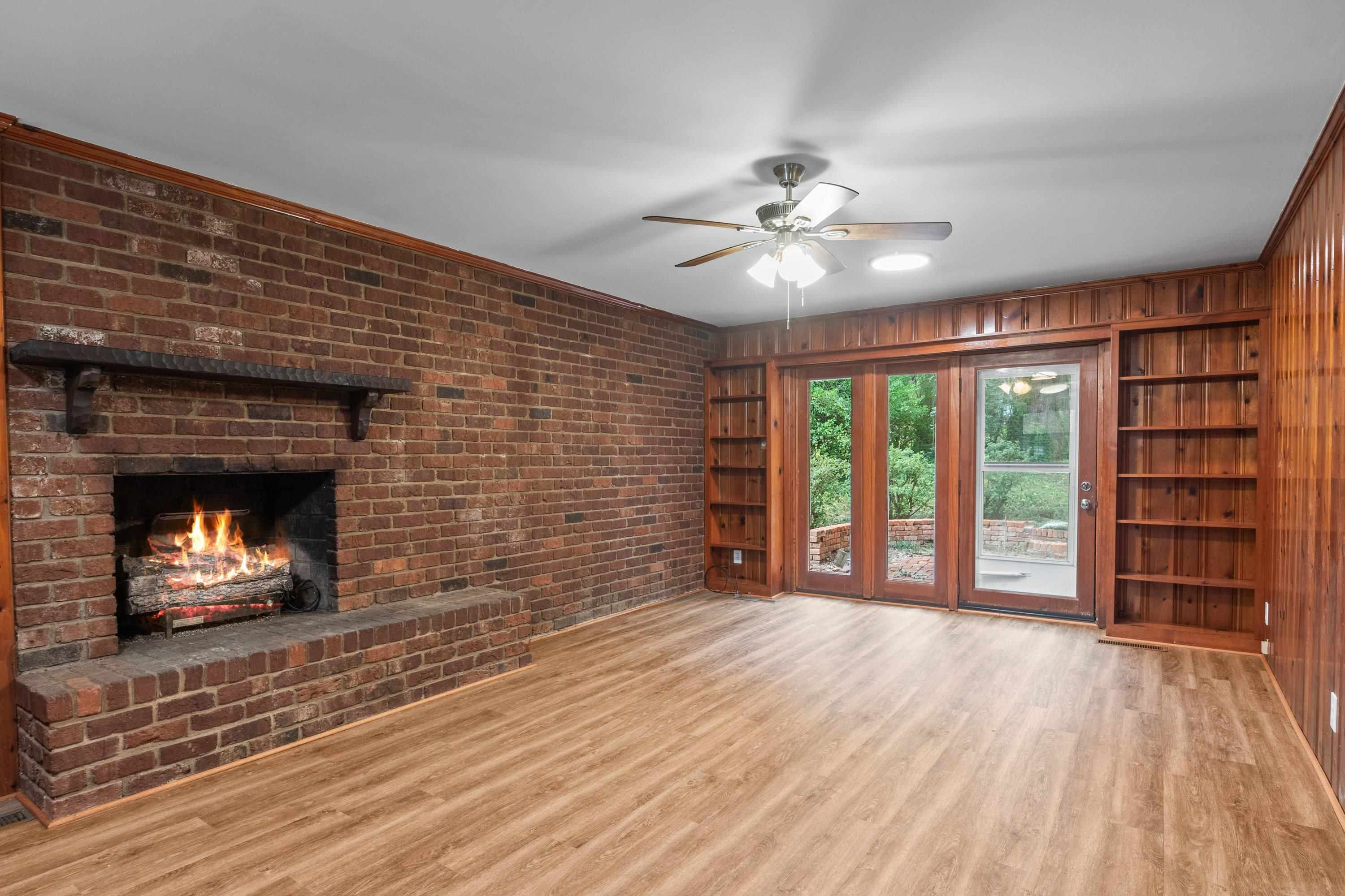 3316 Julian Drive Raleigh, NC 27604 - Photo 13 of 43 a view of an empty room with a fireplace and a window