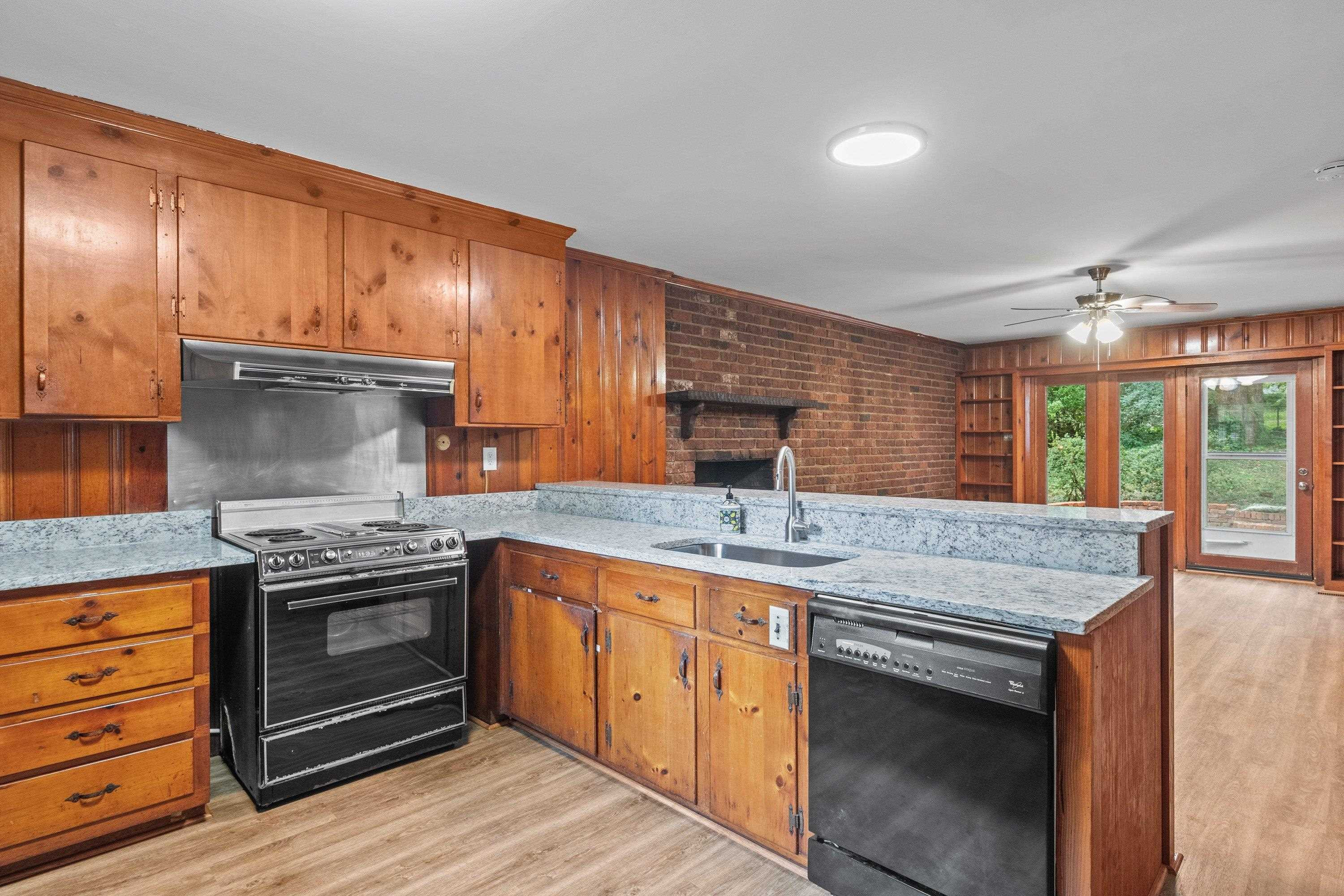 3316 Julian Drive Raleigh, NC 27604 - Photo 19 of 43 a kitchen with stainless steel appliances granite countertop wooden cabinets and a sink