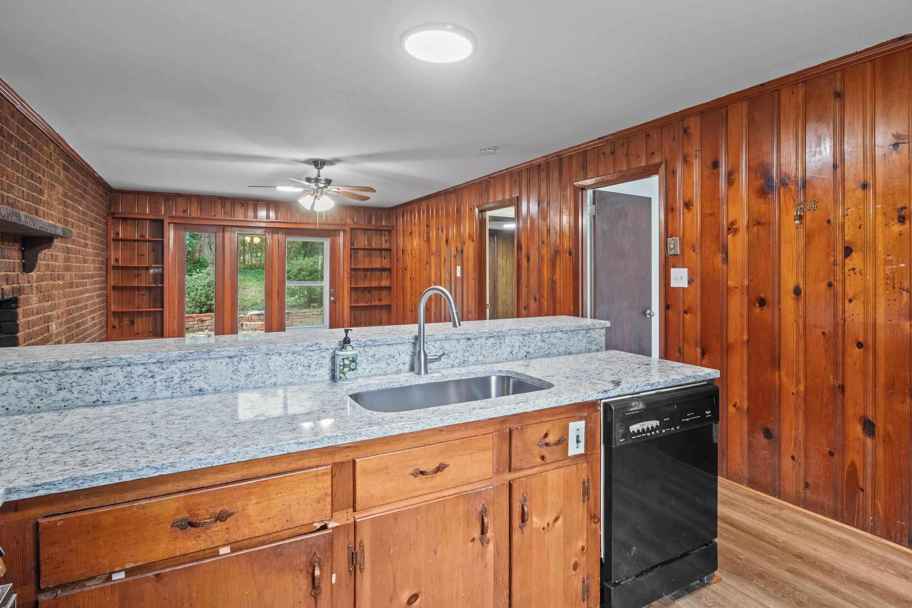 3316 Julian Drive Raleigh, NC 27604 - Photo 22 of 43 a kitchen with stainless steel appliances granite countertop a sink and a large window