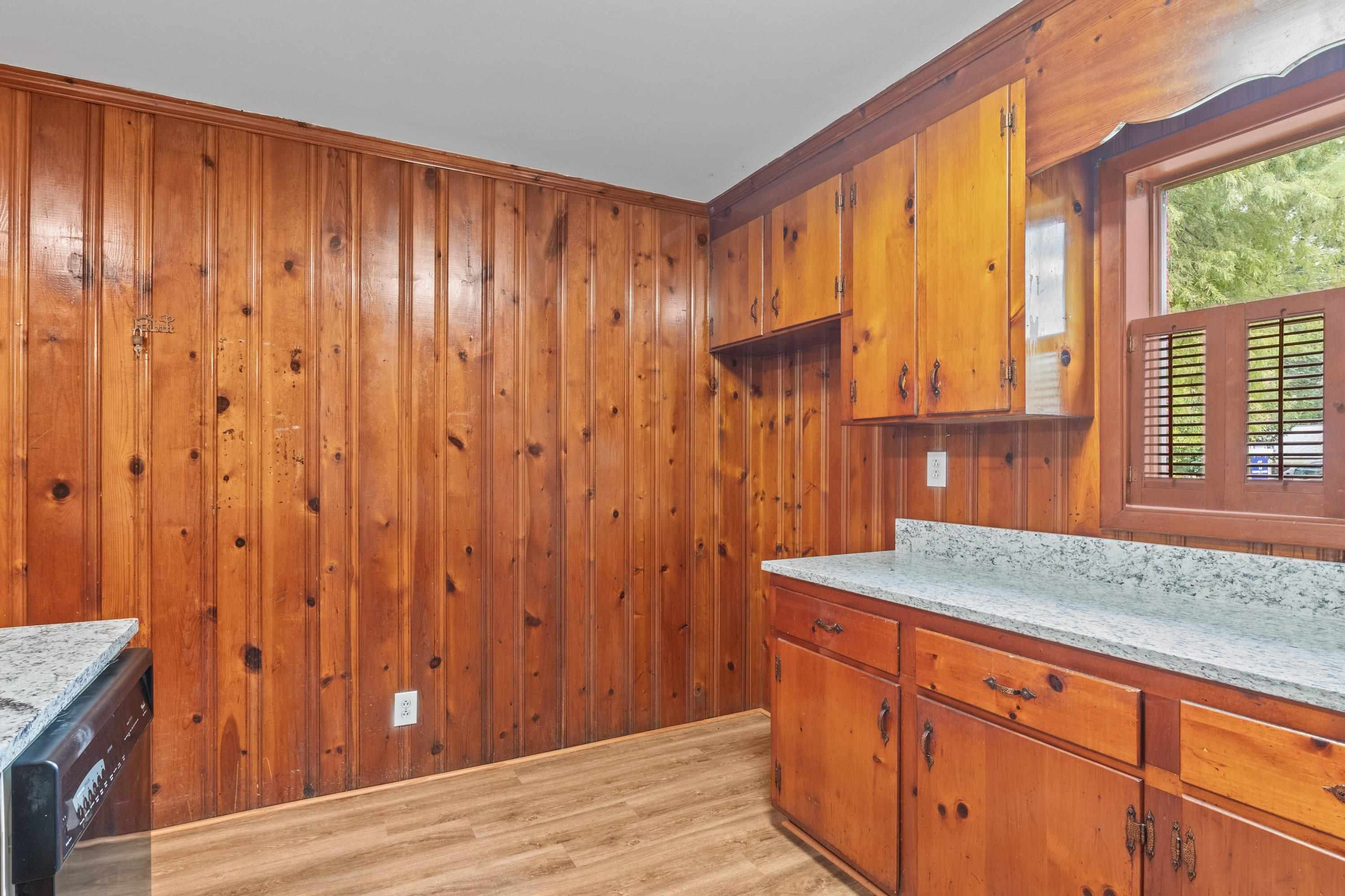 3316 Julian Drive Raleigh, NC 27604 - Photo 23 of 43 a view of a kitchen with granite countertop wooden cabinets and sink