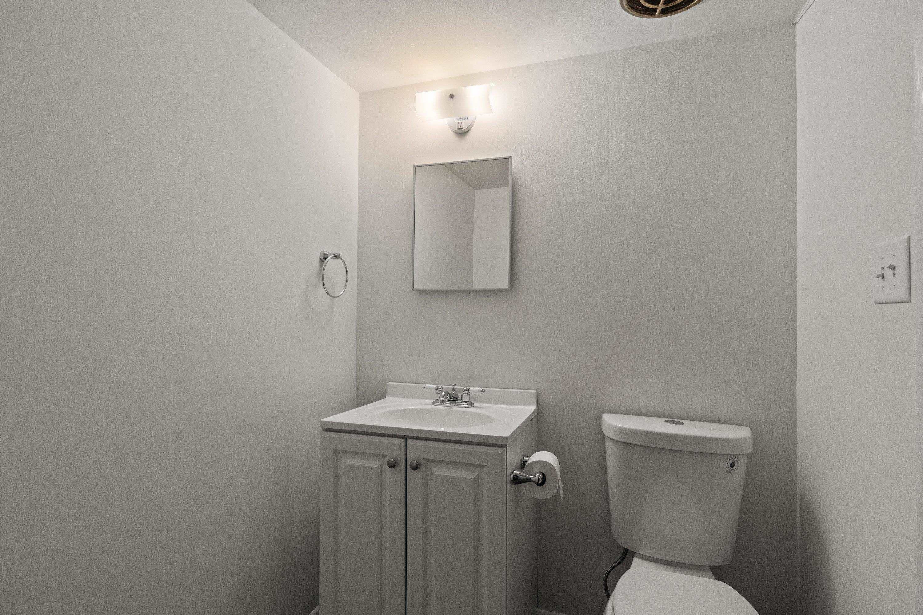3316 Julian Drive Raleigh, NC 27604 - Photo 25 of 43 a bathroom with a toilet sink and mirror