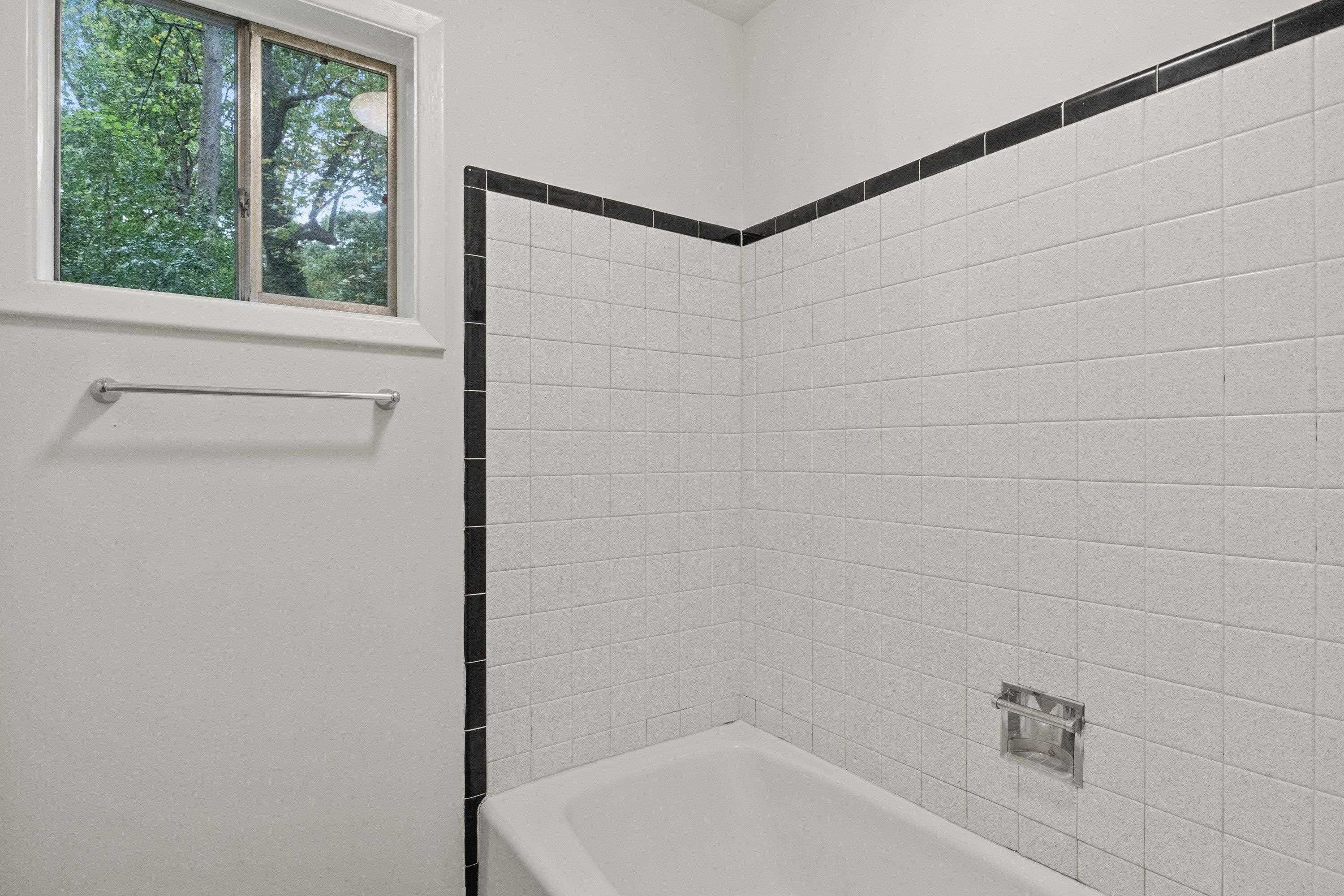 3316 Julian Drive Raleigh, NC 27604 - Photo 27 of 43 a bathroom with a bathtub