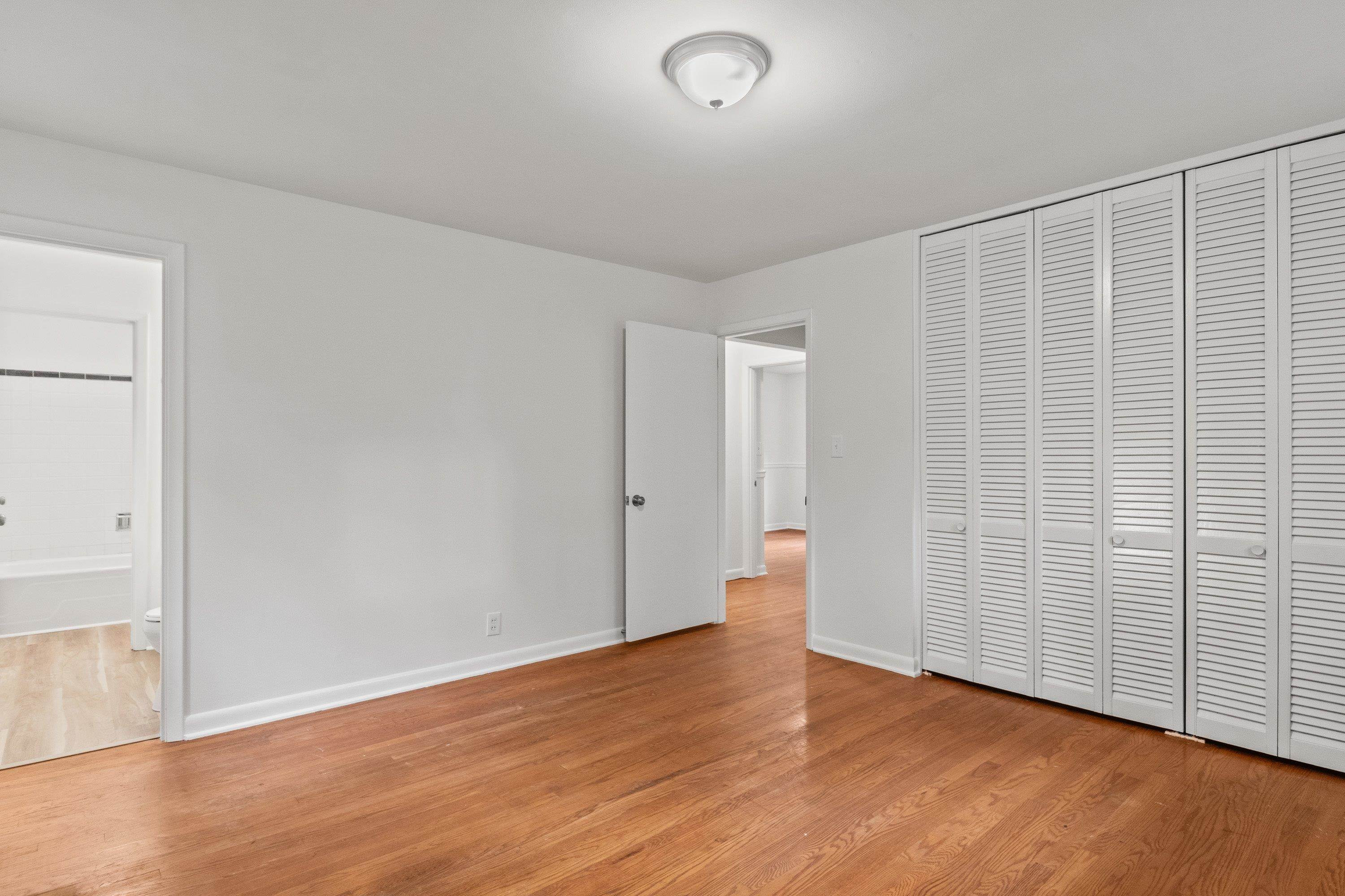 3316 Julian Drive Raleigh, NC 27604 - Photo 31 of 43 a view of an empty room with wooden floor