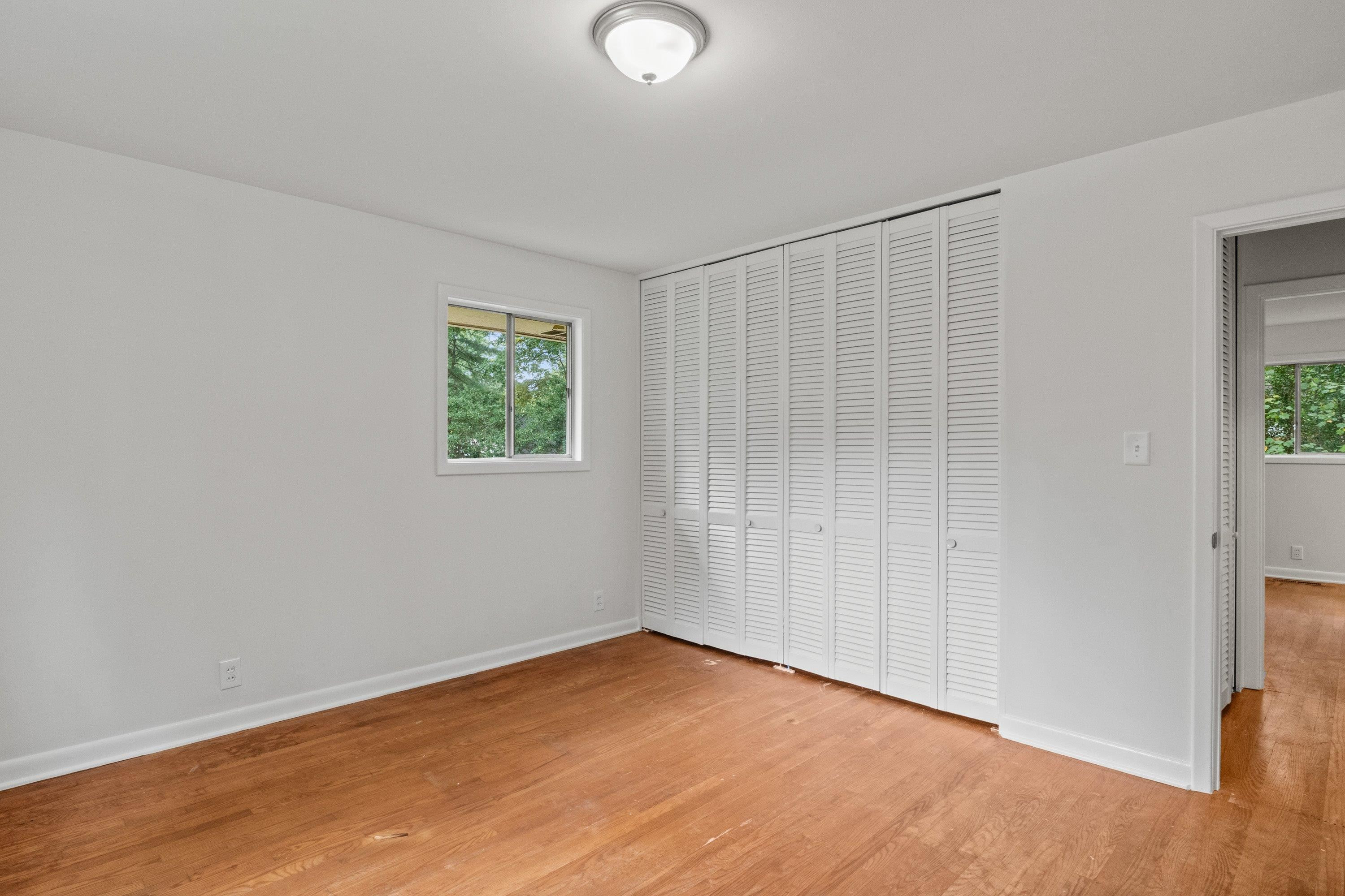 3316 Julian Drive Raleigh, NC 27604 - Photo 35 of 43 a view of an empty room with wooden floor and a window