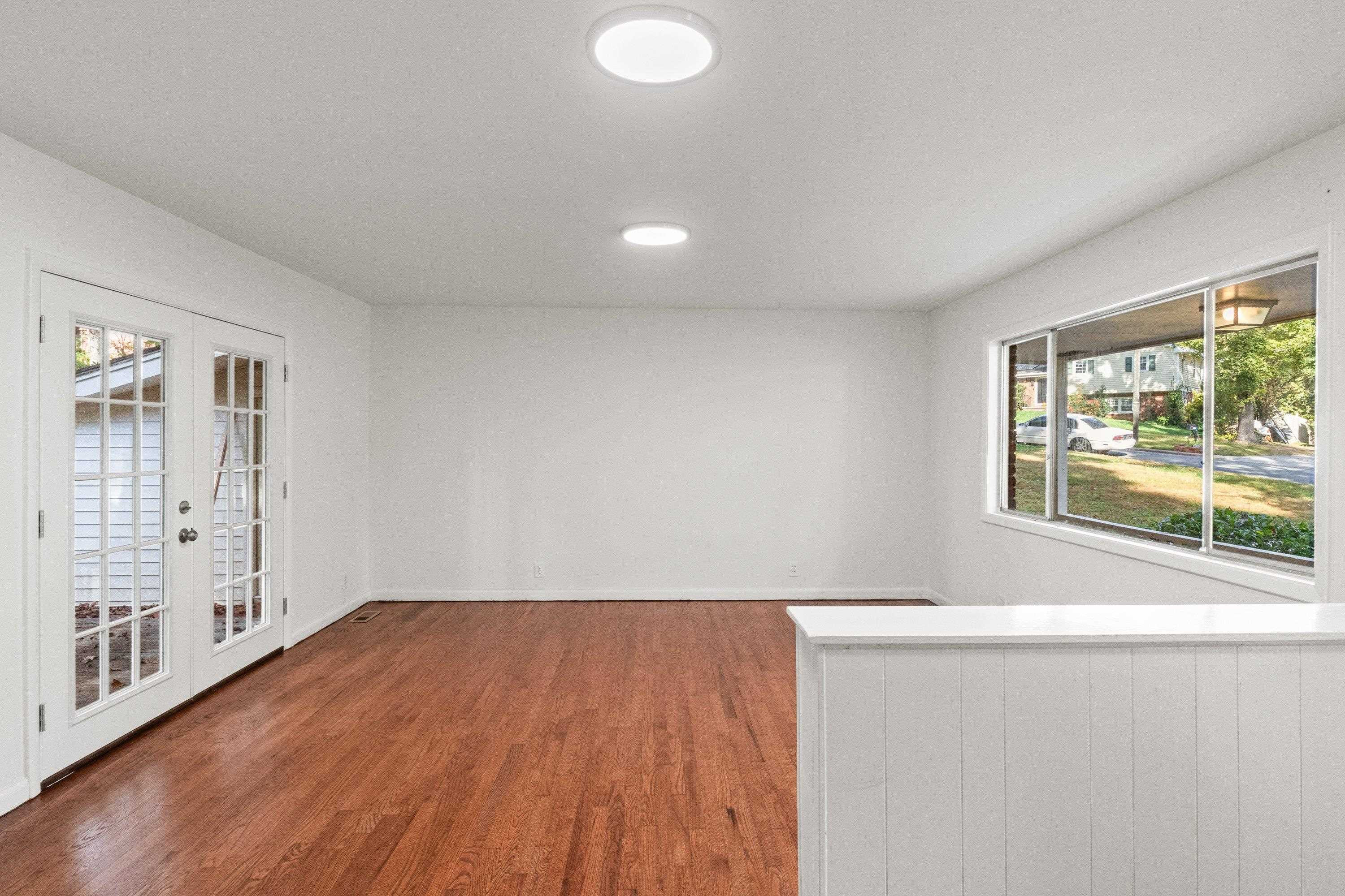 3316 Julian Drive Raleigh, NC 27604 - Photo 4 of 43 wooden floor in an empty room with a window