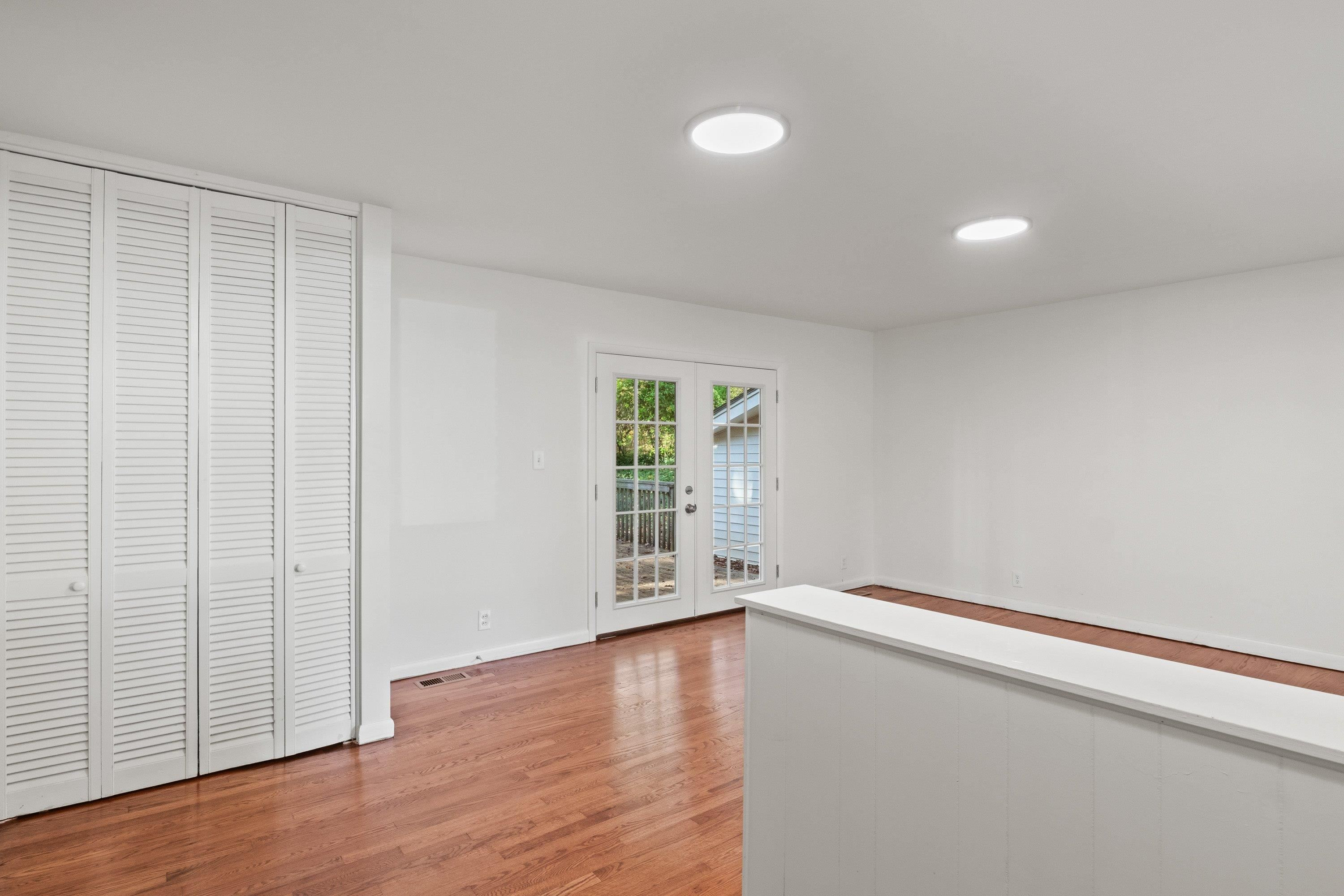 3316 Julian Drive Raleigh, NC 27604 - Photo 5 of 43 wooden floor in an empty room with a window