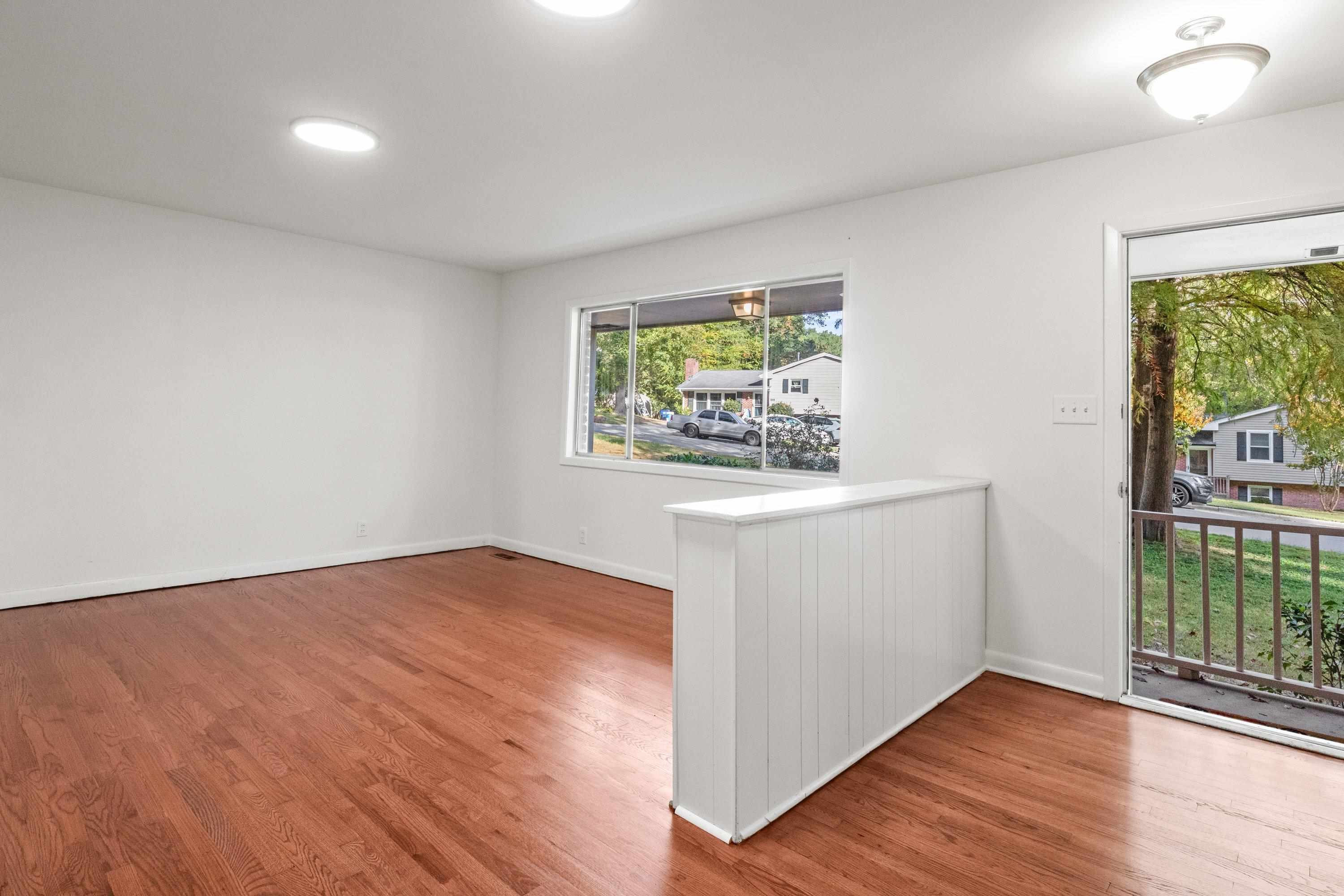 3316 Julian Drive Raleigh, NC 27604 - Photo 6 of 43 wooden floor in an empty room with a window