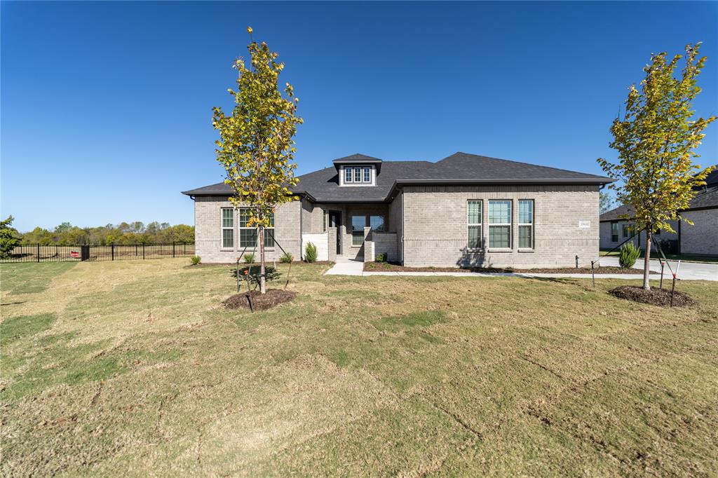 3908 Friendship Court Forney, TX 75126 - Photo 2 of 29 a front view of a house with a garden