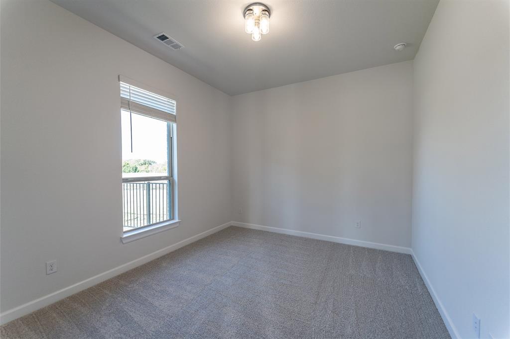 3908 Friendship Court Forney, TX 75126 - Photo 26 of 29 an empty room with windows