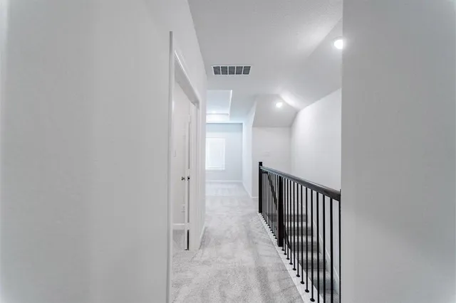 a view of a hallway with entryway