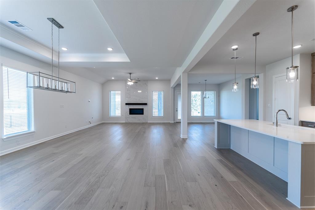 3908 Friendship Court Forney, TX 75126 - Photo 3 of 29 a view of kitchen and sink with large windows