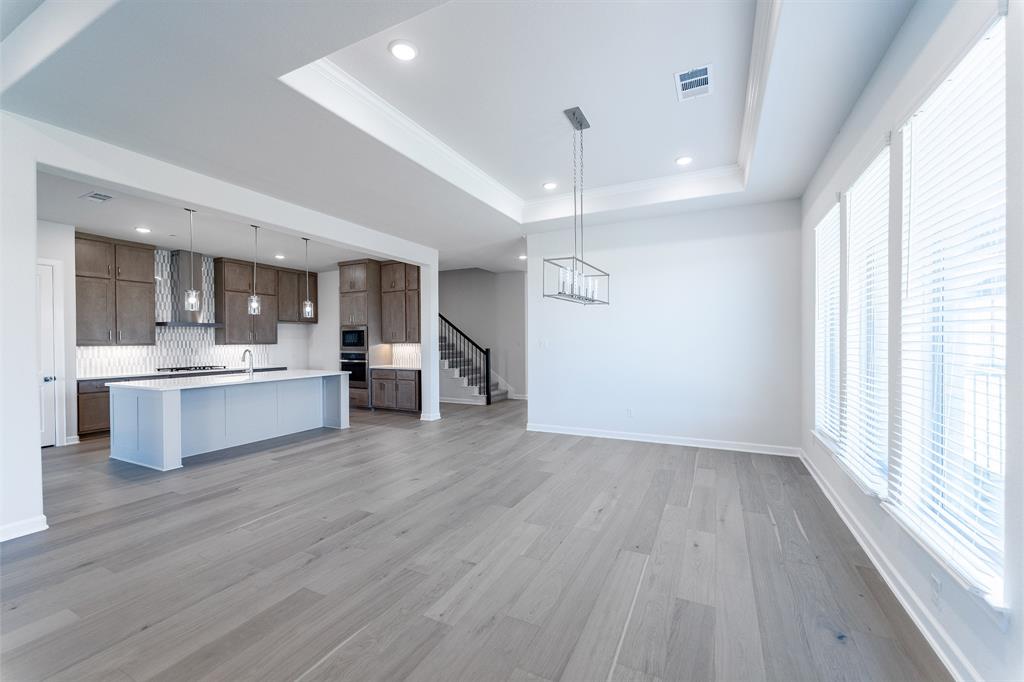 3908 Friendship Court Forney, TX 75126 - Photo 6 of 29 a view of kitchen with sink and wooden floor