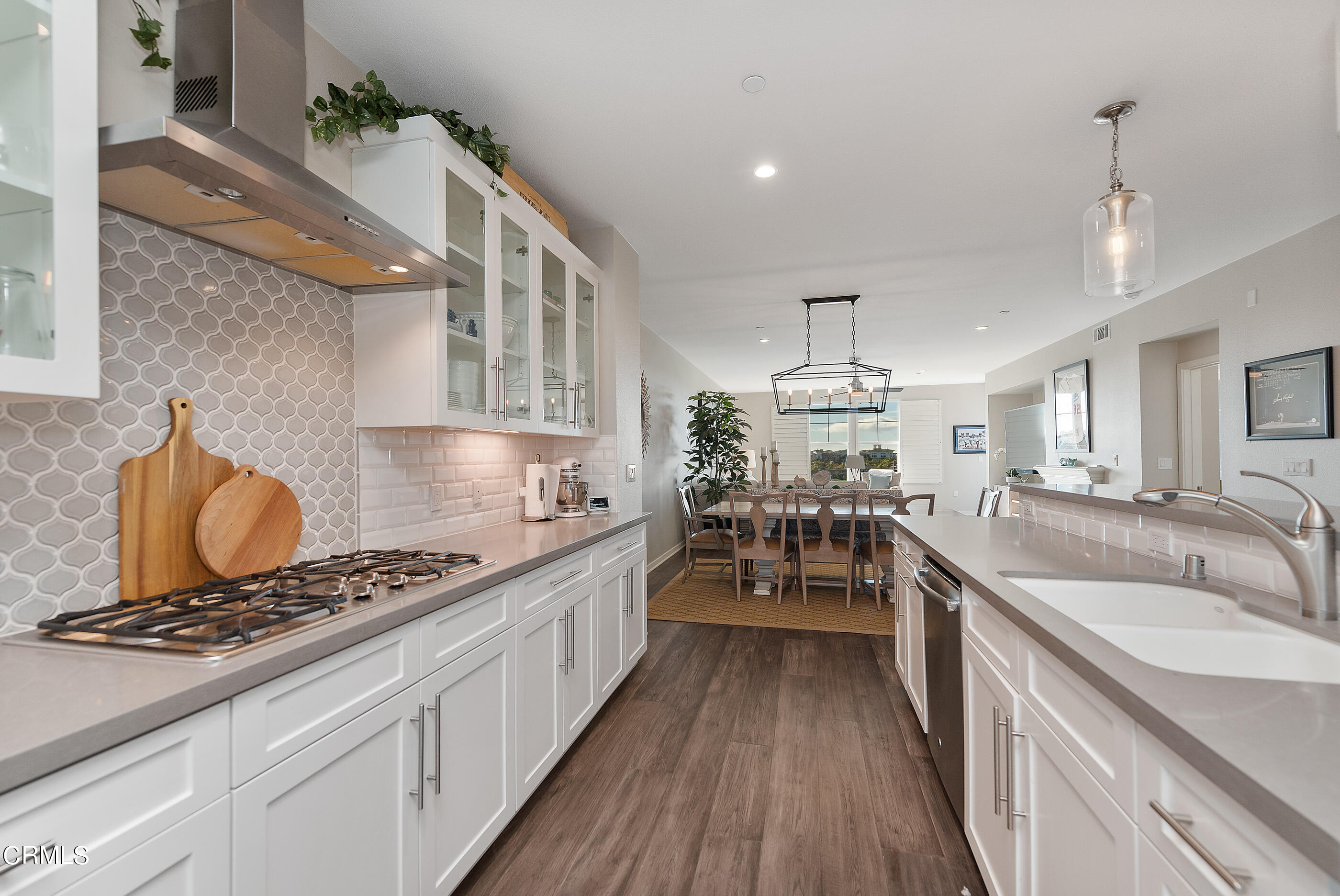 4048 Tradewinds Drive Oxnard, CA 93035 - Photo 16 of 53 a kitchen with sink stove and cabinets