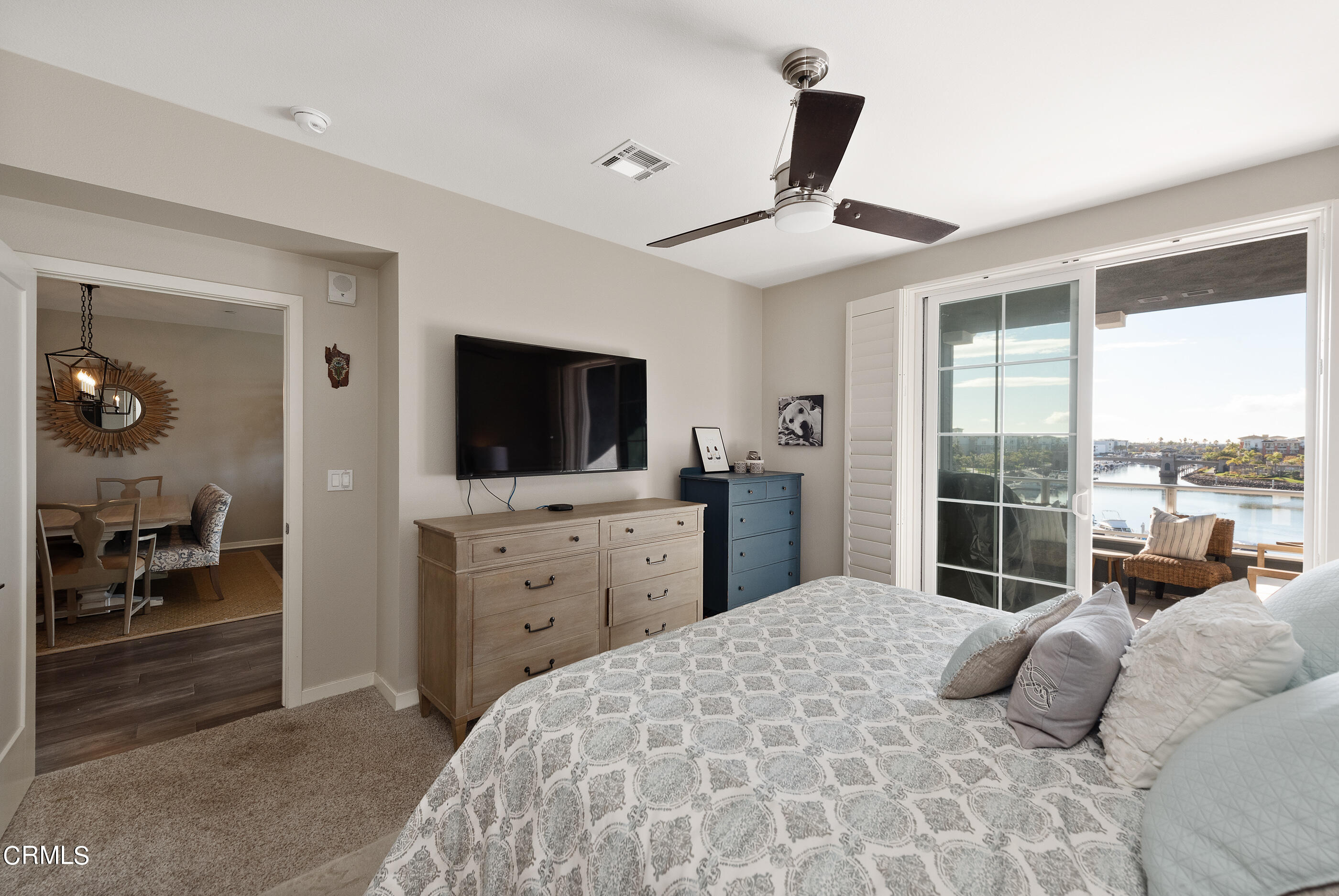 4048 Tradewinds Drive Oxnard, CA 93035 - Photo 18 of 53 a bedroom with a large bed and a flat tv screen