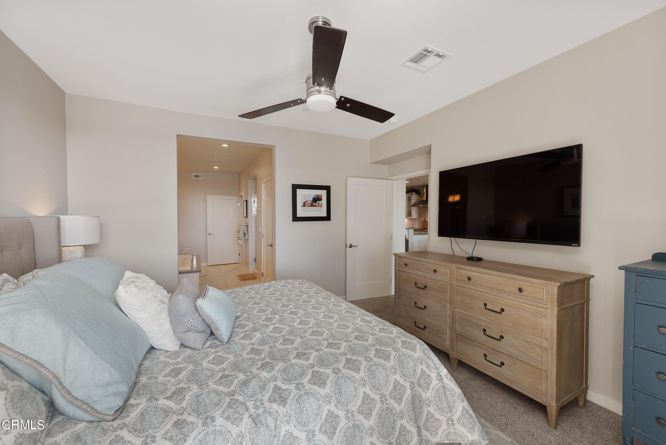 4048 Tradewinds Drive Oxnard, CA 93035 - Photo 19 of 53 a bedroom with a large bed and a flat screen tv